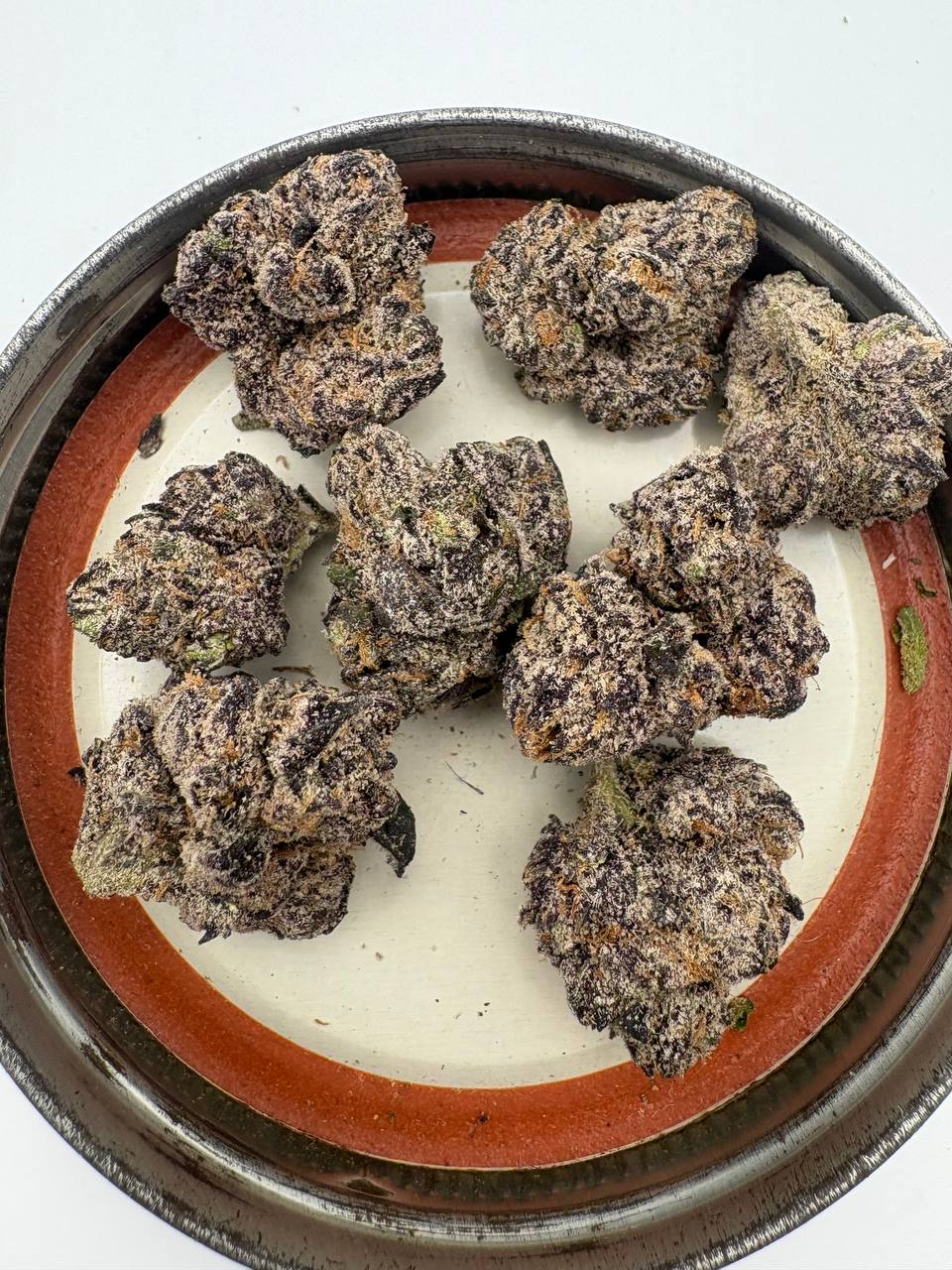 Premium exotics . Cherry noir is a treat, head banger is great daytime weed, haven’t smoked much biscotti yet but it’s quite loud too and I did get a negative review on the 23. Was told it wasn’t smoking and had black ash. When I smoked it i enjoyed it tho but I’ll have to give it another go after hearing that . All of these are less harsh than the exotics by the second half/end of the j